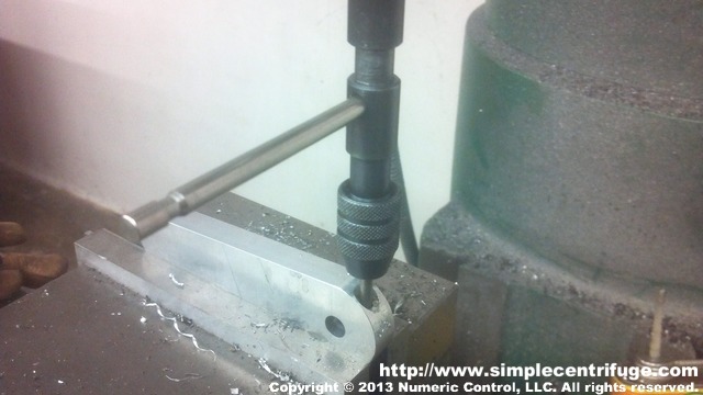 The handle was then drilled, counter bored, and tapped by hand.