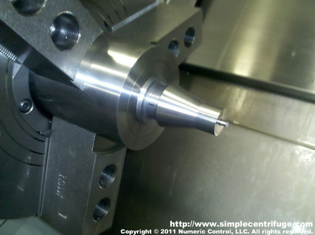 Mount the part on an expansion collet.